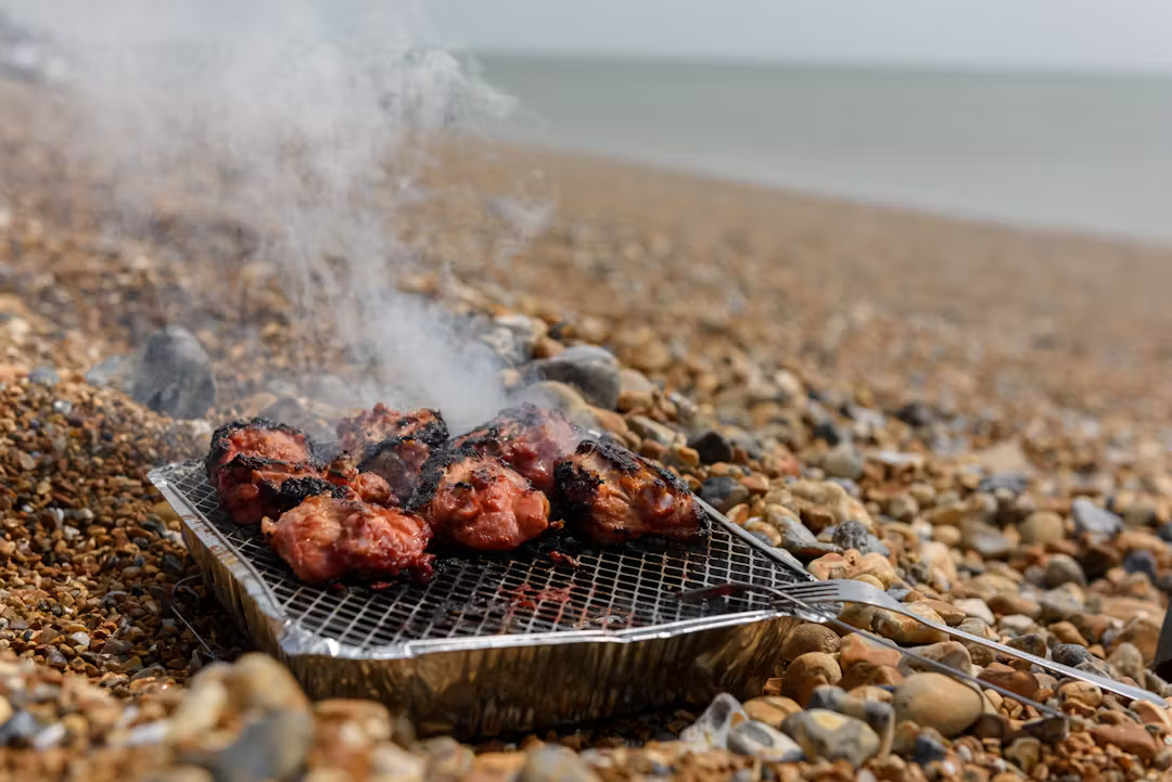 People enjoying beach barbecue